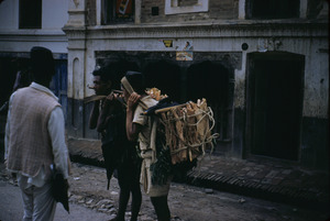 Porters on the street, carrying goods to market