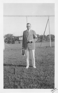 Unidentified member of the class of 1905 standing outside