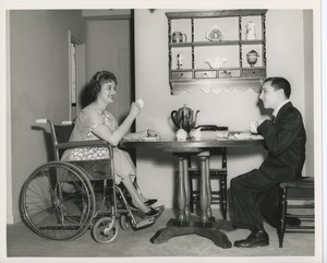 June Trietsch Arzt in wheelchair and unidentified man with disability having tea