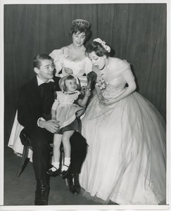 Little girl with turkey leg and performers