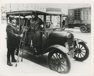 Woman steps out of a car