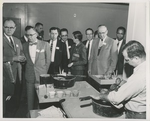 Attendees observe an ICD client at work at the 1959 Rehabilitation Counselors Conference