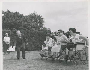 Jeremiah Milbank starts the wheelchair race at the 1957 boatride