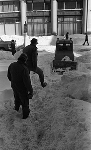 Snow clearing equipment and unidentified men clearing snow on Berkeley Street