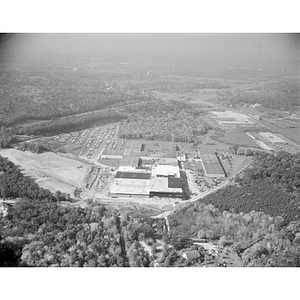 Suburban location of industrial buildings, some new construction, unidentified