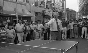 Mayor Kevin White plays table tennis at the 1979 August Moon Festival