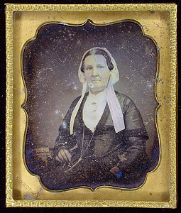 Half-length portrait of an adult female wearing a bonnet