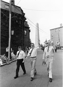 Mayor Raymond L. Flynn (center) walking in Bunker Hill Day parade