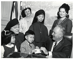 Mayor John F. Collins with unidentified members of the Maryknoll Sisters of St. Dominic, unidentified women and children