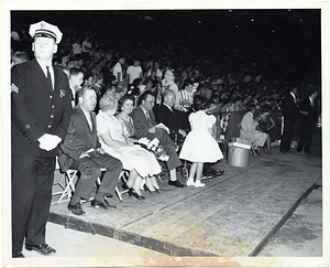 Mayor John F. Collins and Mary Collins in the front row of an audience