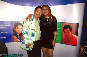A Photograph of Elia Chinò Posing with Someone at a HIV/AIDS Related Event