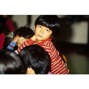 Child in red striped shirt