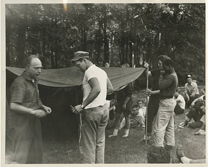 Campers putting up a tent