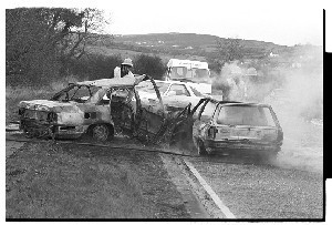 Fatal road crash, Co. Down. Shots show car, fire brigade and dead man