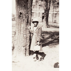 Unidentified woman poses against a tree in Madison Park