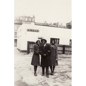 Winifred Irish Hall poses with unidentified friends near Shell station