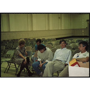 Several Boys' Club staff members sitting in an auditorium, including Jerry Steimel, second from right