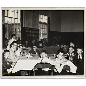 Boys' Club members seated around a table at an awards event