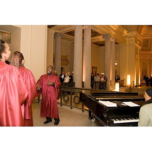 Guests watch a choir sing at the Museum of Fine Arts for the inauguration of President Aoun