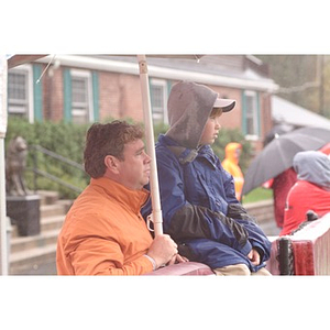 Fans watch the game from the sidelines