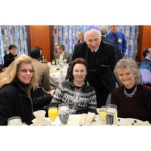 Four guests pose together at the Holocaust Awareness Breakfast