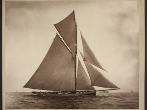 Gaff-rigged sailboat under full sail