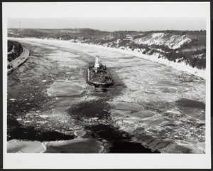 A ship traverses an icy Cape Cod Canal
