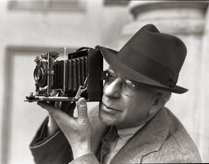 Sam Connor and Bob Emery: man taking a photograph with a Zeiss Ikon camera