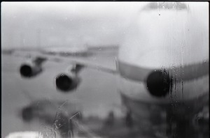 View of airplane out the window in a waiting area at JFK airport