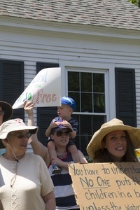 Pro-immigration protesters and signs outside the Chatham town offices building : taken at the 'Families Belong Together' protest against the Trump administration's immigration policies