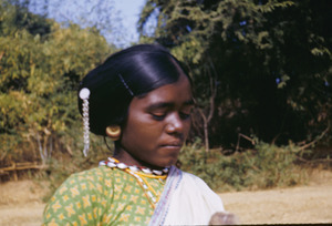 Hair ornaments and other jewelry worn by a young Munda woman