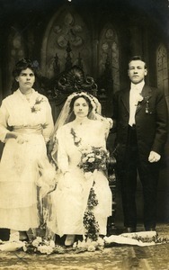 Weronika Skedzielewska (bride), Josef Skedzielewska (groom), and Weronika Rusin Lesinski: formal studio portrait with bride seated in chair