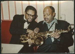 Ben Webster (right) examining a saxophone with unidentified man at the Jazz Workshop
