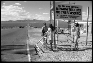 Peace encampment activists talking a security guard at the entrance to the Nevada Test Site