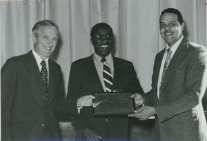 Unidentified man presenting Division of Public Health School of Health Sciences Award of Recognition to Randolph W. Bromery, and William Alexander Darity