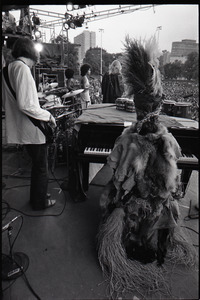 Dr. John at Summerthing's Sunset Series: view from behind Dr. John at the piano with band