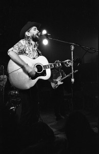 New Riders of the Purple Sage opening for the Grateful Dead at Sargent Gym, Boston University: John 'Marmaduke' Dawson playing acoustic guitar and signing, Dave Nelson in the background