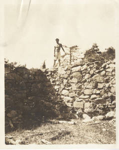 Colin Falconer on rock wall (c. 1932-1933)