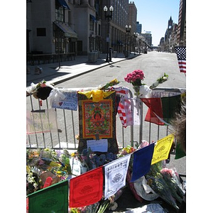 Flags, signs, flowers, and quilts at makeshift Boston Marathon memorial on Boylston Street