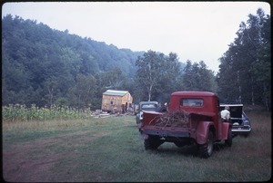 Red pickup truck parked in front of the house, Johnson Pasture Commune