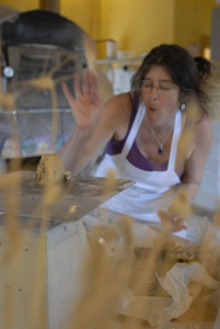 Hungry Ghost Bread: owner and baker Cheryl Maffei weighing cookie dough