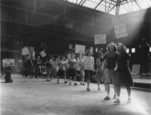 Students marching in Curry Hicks Cage to support senate bill 207