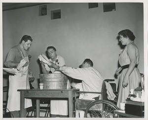 Clients washing dishes during a Club Can Do recording at ICD