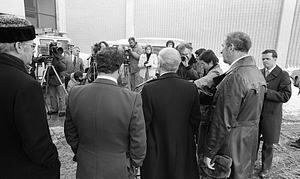 Mayor Kevin White and unidentified officials delivering speech to reporters