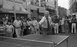 Mayor Kevin White plays table tennis at the 1979 August Moon Festival