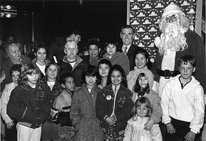 Mayor Raymond L. Flynn with Santa Claus, Rebecca Galeota, Cecilia Galeota and other unidentified children and adults