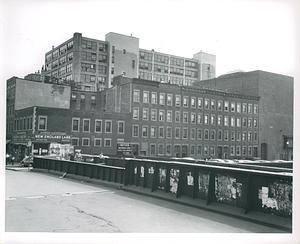 Southwesterly from the railroad bridge on Harrison Avenue showing frontage on Motte Street with the building at 1000 Washington in the background