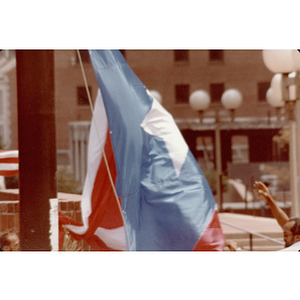 A large Puerto Rican flag being unfurled