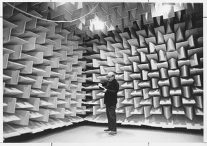 Gilbert C. Tolhurst standing in anechoic chamber