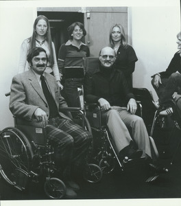 Arnold Friedmann in wheelchair with group